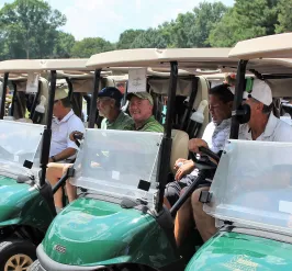 Golfers lined up in carts
