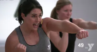 woman punching forward with arm