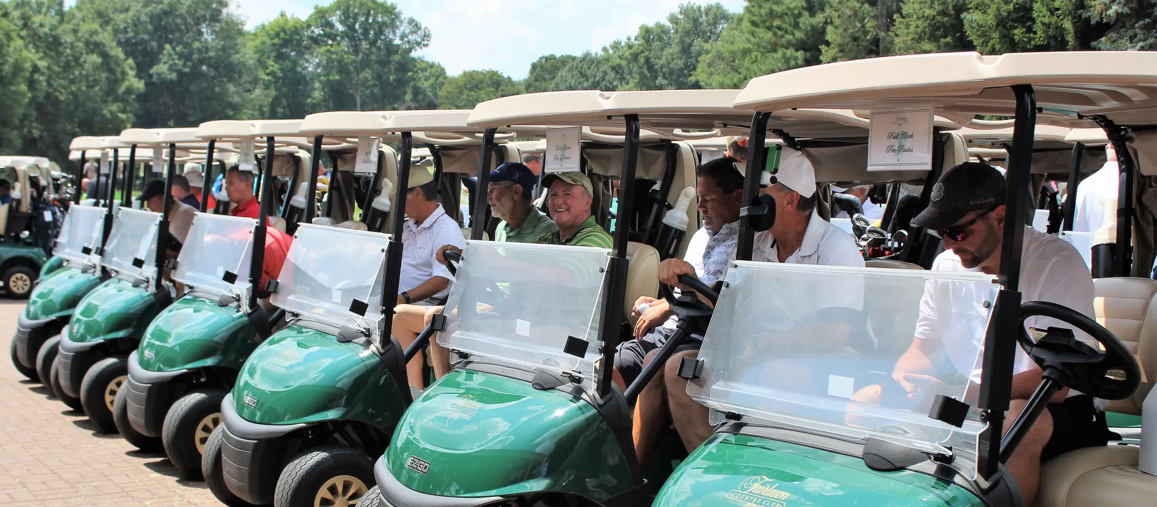 Golfers lined up in carts