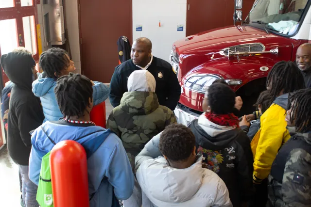Students hear from Akron Fire Chief during Rosa Parks Tour.