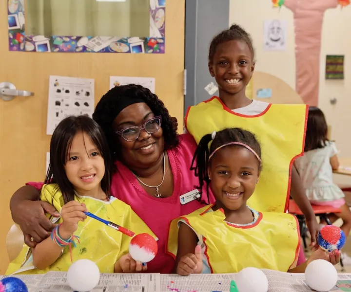 Tammie with three students