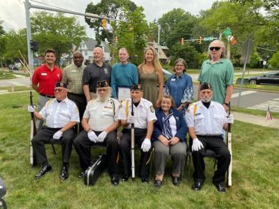 Group of people at a tree dedication at the Riverfront YMCA