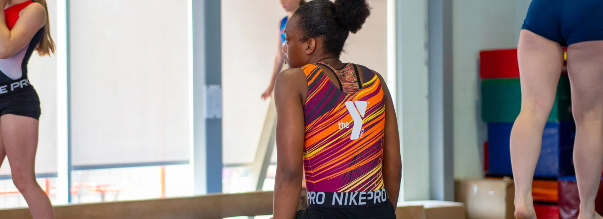 Girl with a Y logo on her leotard